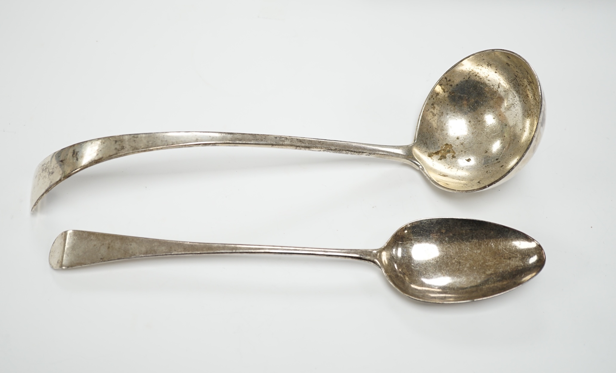 An Edwardian silver Old English pattern soup ladle, London, 1902 and a George III basting spoon, London, 1808, 12.8oz.